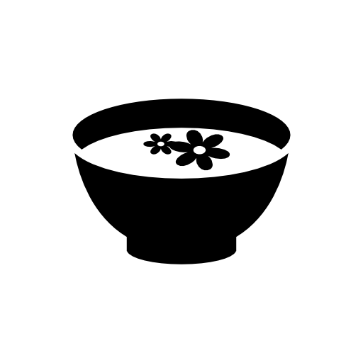 Flowers floating on a liquid inside a bowl
