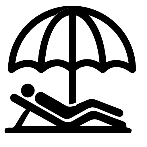 Person lying on a beach under an umbrella