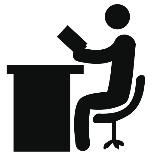 Person reading sitting on a desk