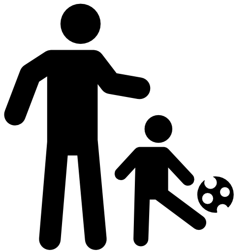Father playing soccer with his son