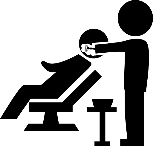 Hairdresser applying hair dye to a client of hair salon