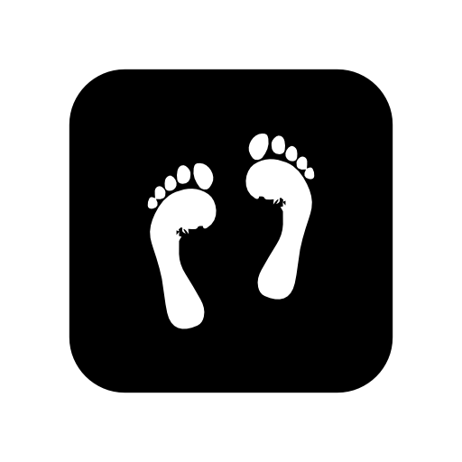 Feet of a human on black square background