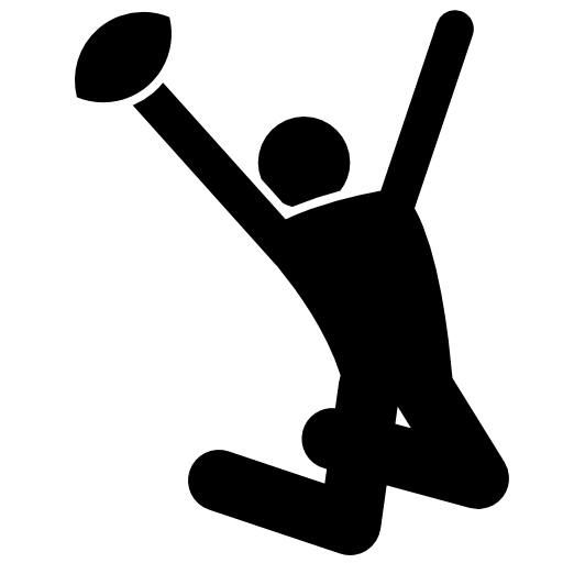 Rugby player celebrating with the ball