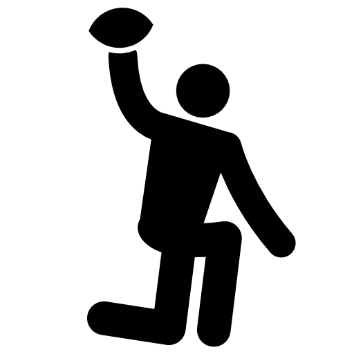 Rugby player on one knee with the ball in a hand