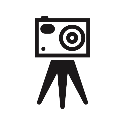 Photo camera front on a tripod