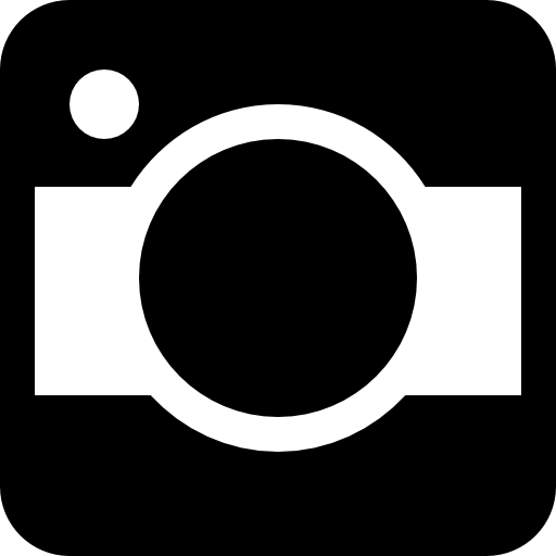 Photo camera of rounded square shape