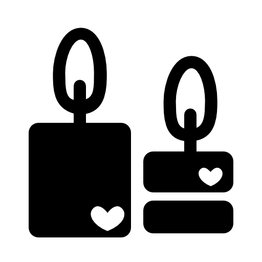 Couple of romantic candles burning with hearts symbols