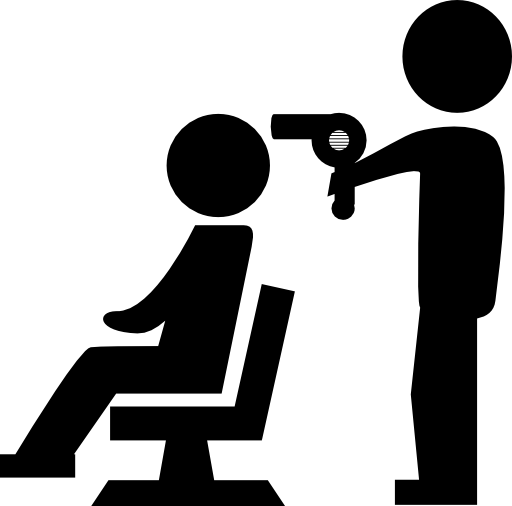 Hairdresser drying the hair of a client sitting on a chair in front of him