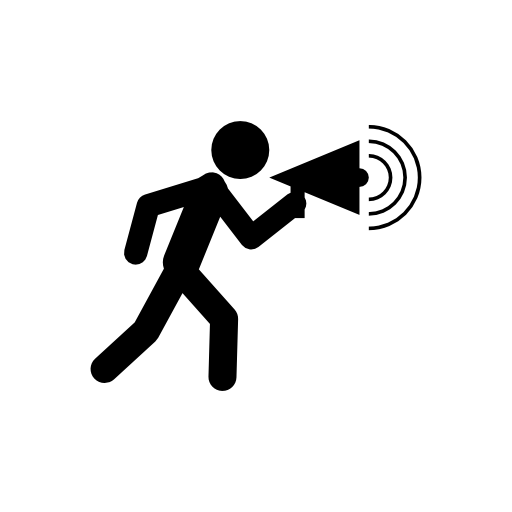 Man walking talking by a speaker