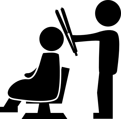 Hairdresser standing with a hair straightener behind the client sitting on a chair
